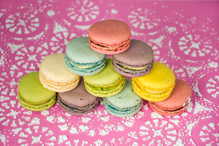 Stack of colorful macaroons on powdered sugar designの写真素材