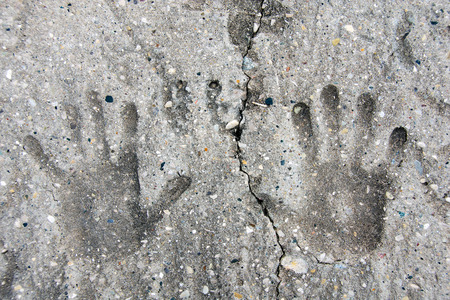 pair of hand prints imprinted in cement