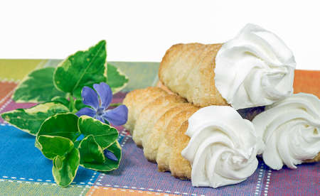 cream horn pastry stack with myrtle flowerの写真素材