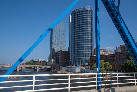 city building framed in blue steel bridge structure in Grand Rapids Michiganの写真素材