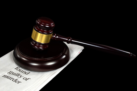 wooden gavel on newspaper with crime headlineの写真素材