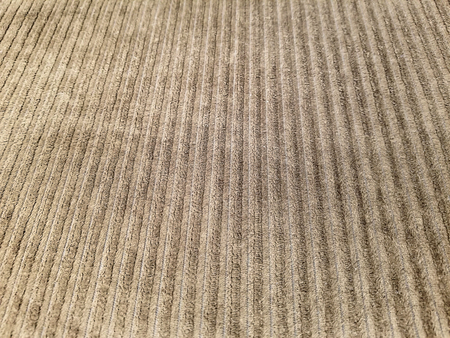 close up of worn brown corduroy fabric backgroundの写真素材