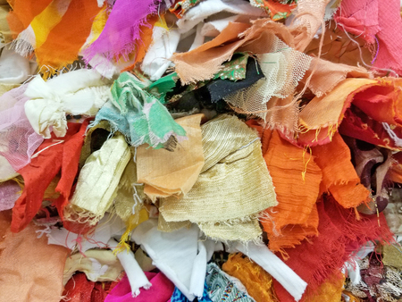 close up of variety of colorful pieces of fabric backgroundの写真素材