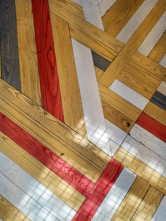 red and brown wood flooring crisscross abstract pattern with shadowの写真素材