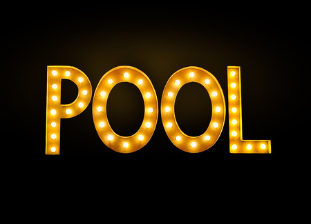glowing neon billiard pool hall sign isolated on black in billiard hallの写真素材