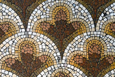 brown and gold ornate mosaic tile floor pattern