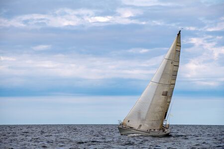 single sailboat in Michigan regatta heeling on Lake Michigan