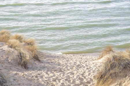 beach sand path between two sand dunes on Lake Michigan coastline
