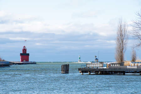 Red lighthouse in Holland Michigan harbor in winterの写真素材