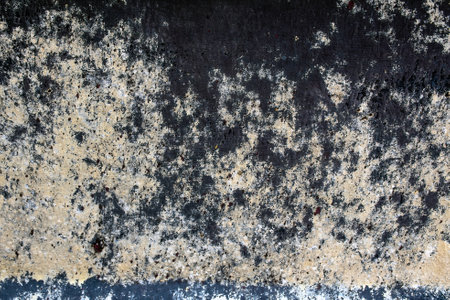Close up of faded blue paint on a metal surface