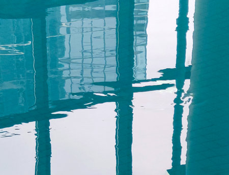 City building reflection in swimming pool waterの写真素材