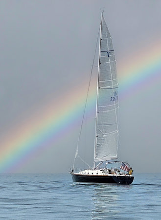Sailboat on Lake Michigan with a rainbow