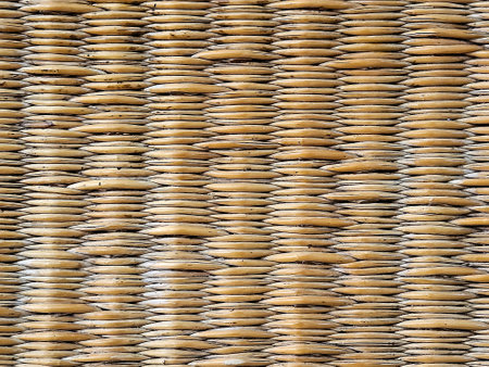 Close-up of a golden brown wooden wicker weave pattern