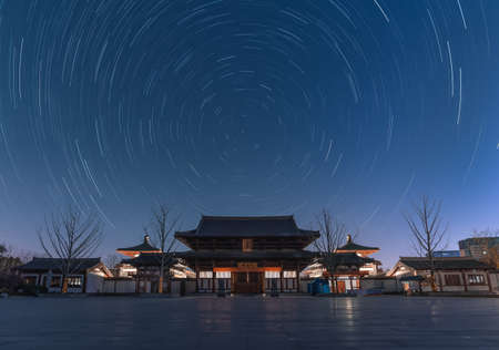 Star trails over Shenhua Temple on a clear night in Jiangyin, Jiangsu.