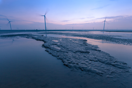 Wind turbines painted on China Yellow Beachの写真素材