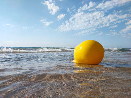 Large sea buoy in the sea against the skyの写真素材