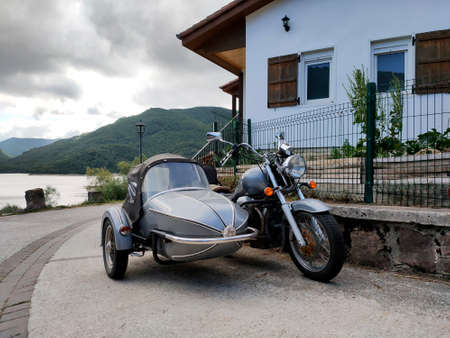 Camino de Santiago, city of Eugui Navarra, Lake Eugui, Basque house and old motorcycle with sidecar, summer 2021のeditorial素材