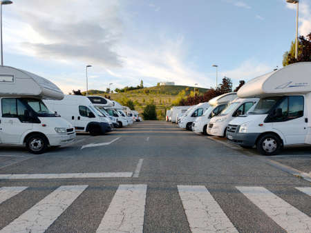 parking motorhome with a water tower in the background in the city of pamplona spainのeditorial素材