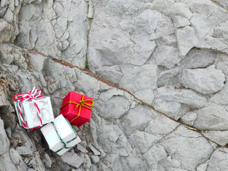 gifts in boxes lie on the stone, background for congratulationsの写真素材