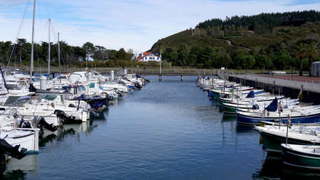 yacht marina in the village of Getaria, with mountains in the background, November 8, 2021, spainのeditorial素材