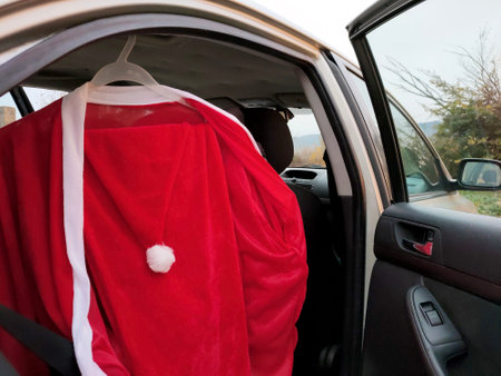 Santa Claus costume weighs in the cabin of an open carの写真素材