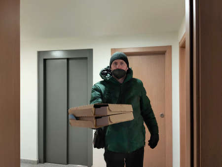 pizza delivery man with the wrong mask on