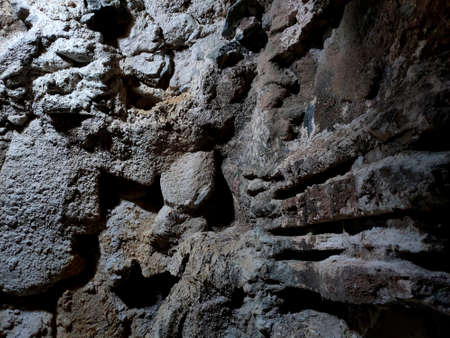 background. texture. stone wall on which the light is directedの写真素材