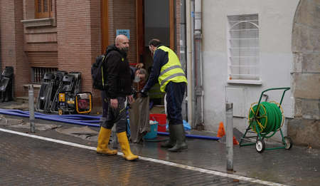 people pump out water from living quarters Pamplona, ââNavarra, 11 December 2021のeditorial素材