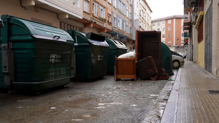 people demolish damaged furniture after flooding to garbage bins, city of Pamplona, ââ12 December 2021のeditorial素材