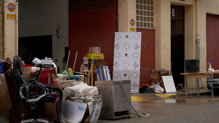 people throw furniture out of sunken houses after flooding in the city of Pamplona, ââDecember 12, 2021のeditorial素材