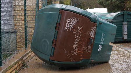 aftermath of the flooding of the Arga River, dirty streets, an overturned waste container December 12, 2021のeditorial素材