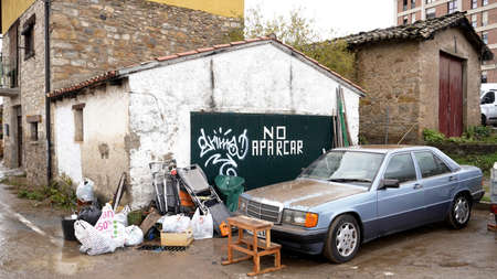 cleaning the garage, wet furniture on the street, the consequences of the flood of the Arga River on December 12, 2021のeditorial素材