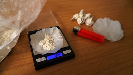 spread white powder in doses, weighing with scalesの写真素材