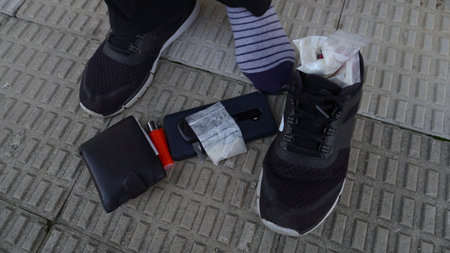 Removed paint from the foot of a man in which a white powder is hiddenの写真素材