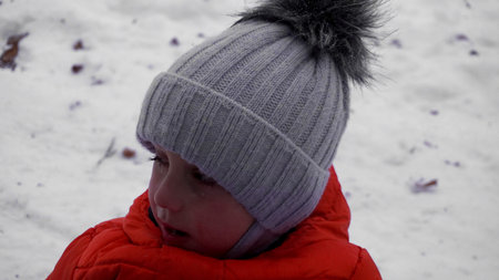 a child cries in the winter in the forest