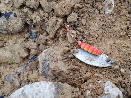 fishing tackle lies at the bottom of a dry lakeの写真素材