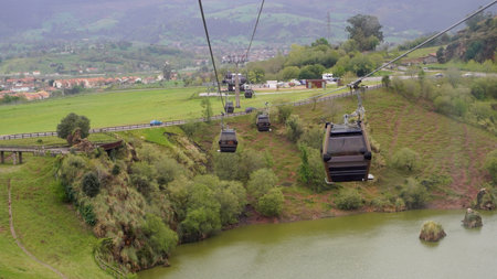 cable car passing over the mountains. cantabriaの写真素材
