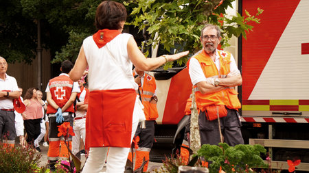 A woman attracts the attention of an ambulance worker at the Sanfermin celebration. Pamplona (Navara) Spain. July 6, 2023のeditorial素材