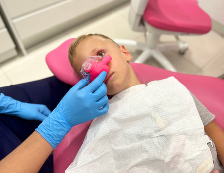 Sedation with nitrous oxide to a child. in a dental clinicの写真素材