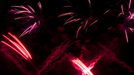 crimson and purple fireworks on black backgroundの写真素材