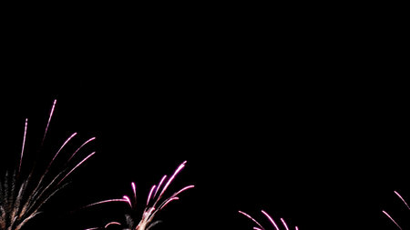 fireworkscard. Beautiful fireworks, in purple color. Isolated on black background. Christmas card, New Year holidaysの写真素材