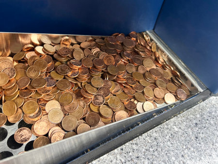one cent coins, in the exchange machineの写真素材