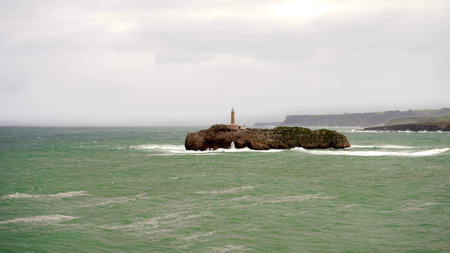 island with a lighthouse, in the coastal area of ââââSantander Spainの写真素材