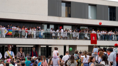 City hall building, throwing sweets to the people, in honor of the opening of the festivities. Sarriguren Navarra Spain June 6, 2024のeditorial素材