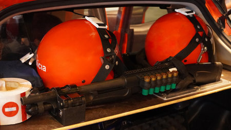 Rifle carbine and shockproof helmets are in the trunk of the car. riot police equipmentの写真素材