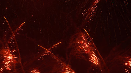 background image. splashes of fireworks in burgundy color