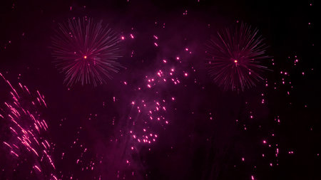 background image: fireworks explosions in the evening sky, in purple tones
