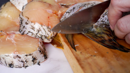 cut the fish into rings with a large knife