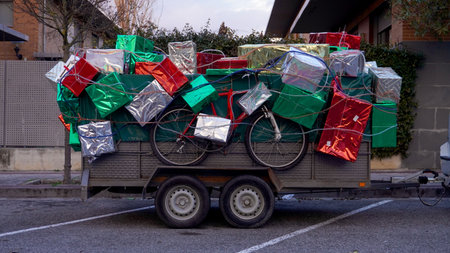 car trailer filled with gift boxes parked on the streetの写真素材