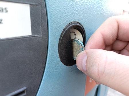 Paying for parking with dirty coinsの写真素材